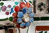 Bangkok Wat Arun - polychromatic mosaic flowers made from discarded ceramic pottery cut into petal shape. 